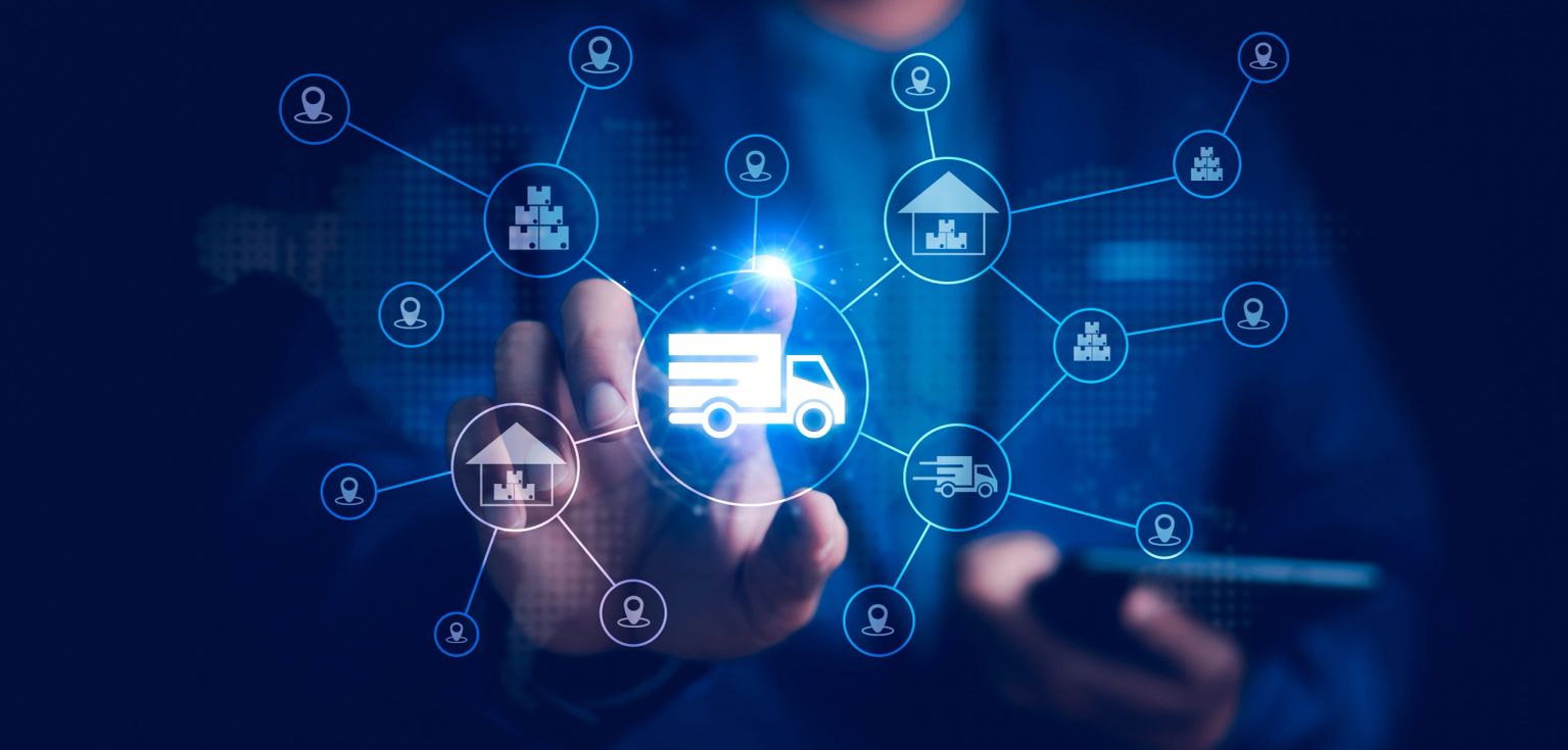 Businessman pointing at a glowing delivery truck and supply chain network