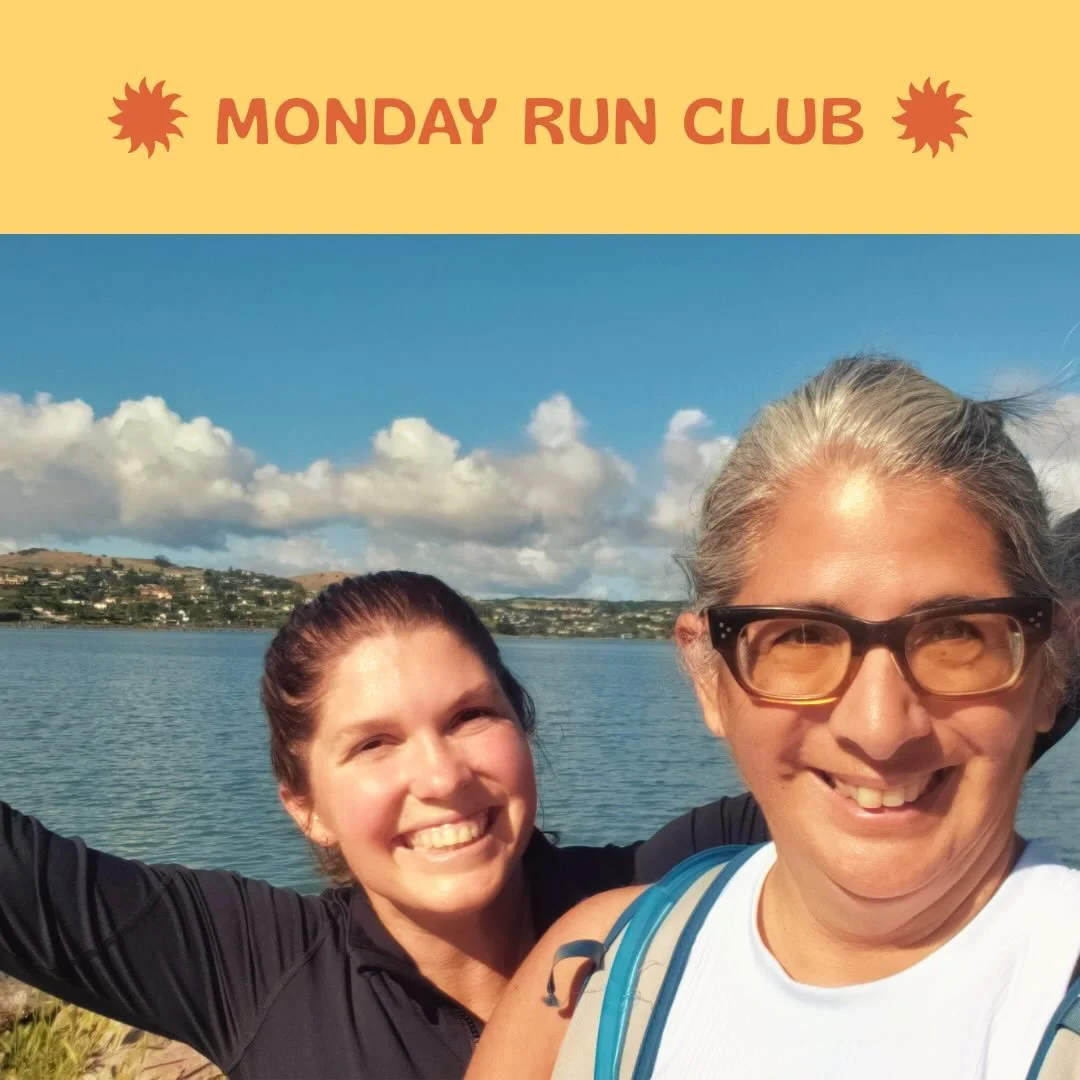 Two women smiling outdoors at Monday Run Club