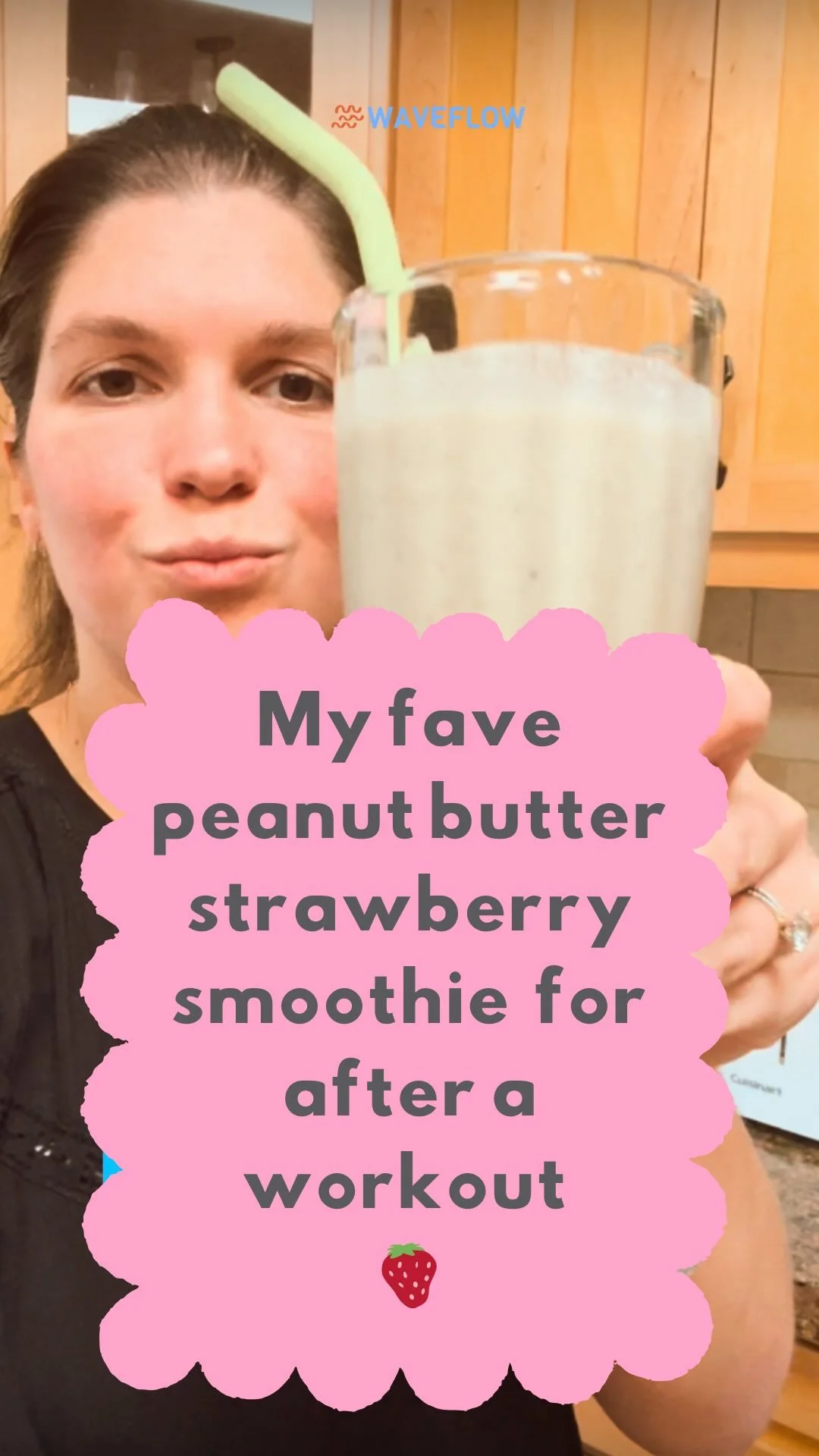 Kyla holding a peanut butter strawberry smoothie
