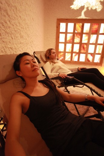 Two women reclining in the Himalayan salt spa room