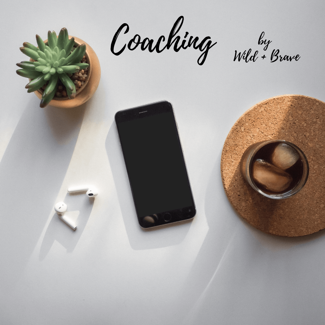 Coaching by Wild + Brave — a flat-lay of a phone, AirPods, succulent, and iced drink