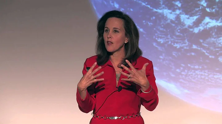 Woman in red suit presenting with globe projection