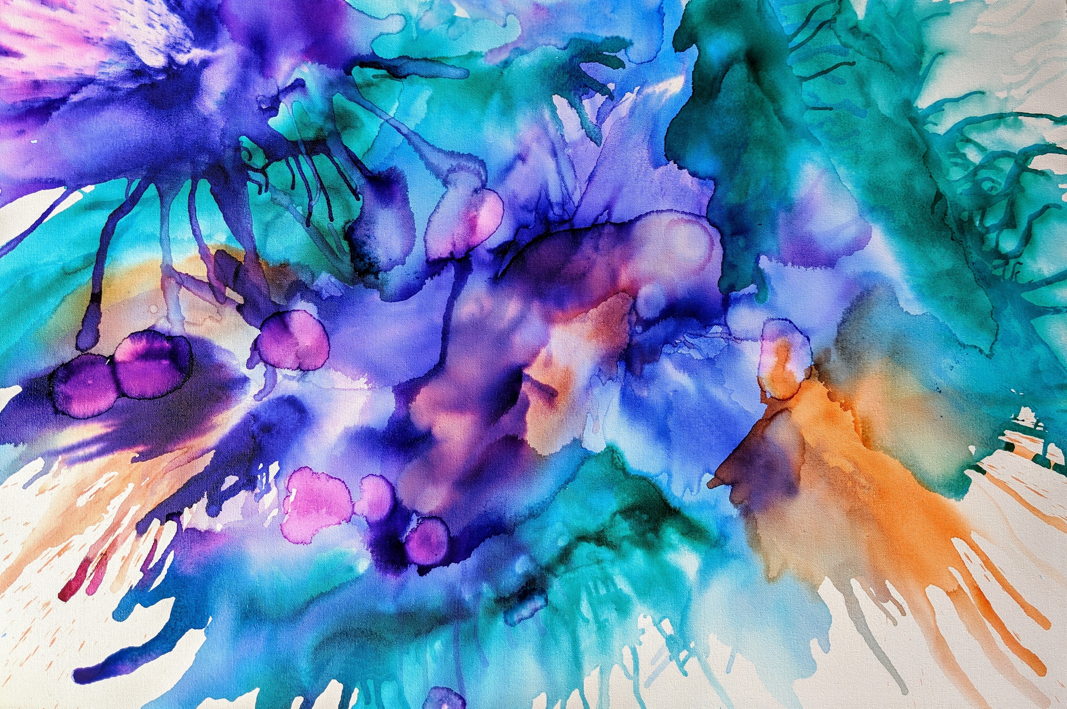 Abstract watercolor painting in blue, teal, purple, pink and orange