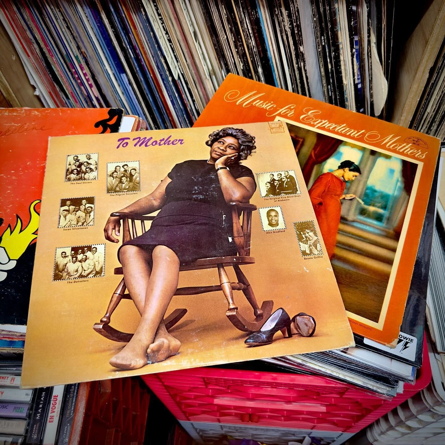 Close-up of the album covers To Mother and Music for Expectant Mothers resting in a record bin
