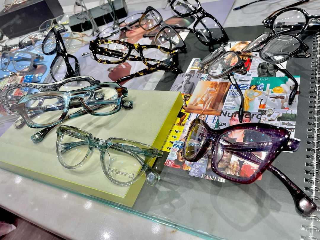 Clear and metal frames on the shop's lit display shelf