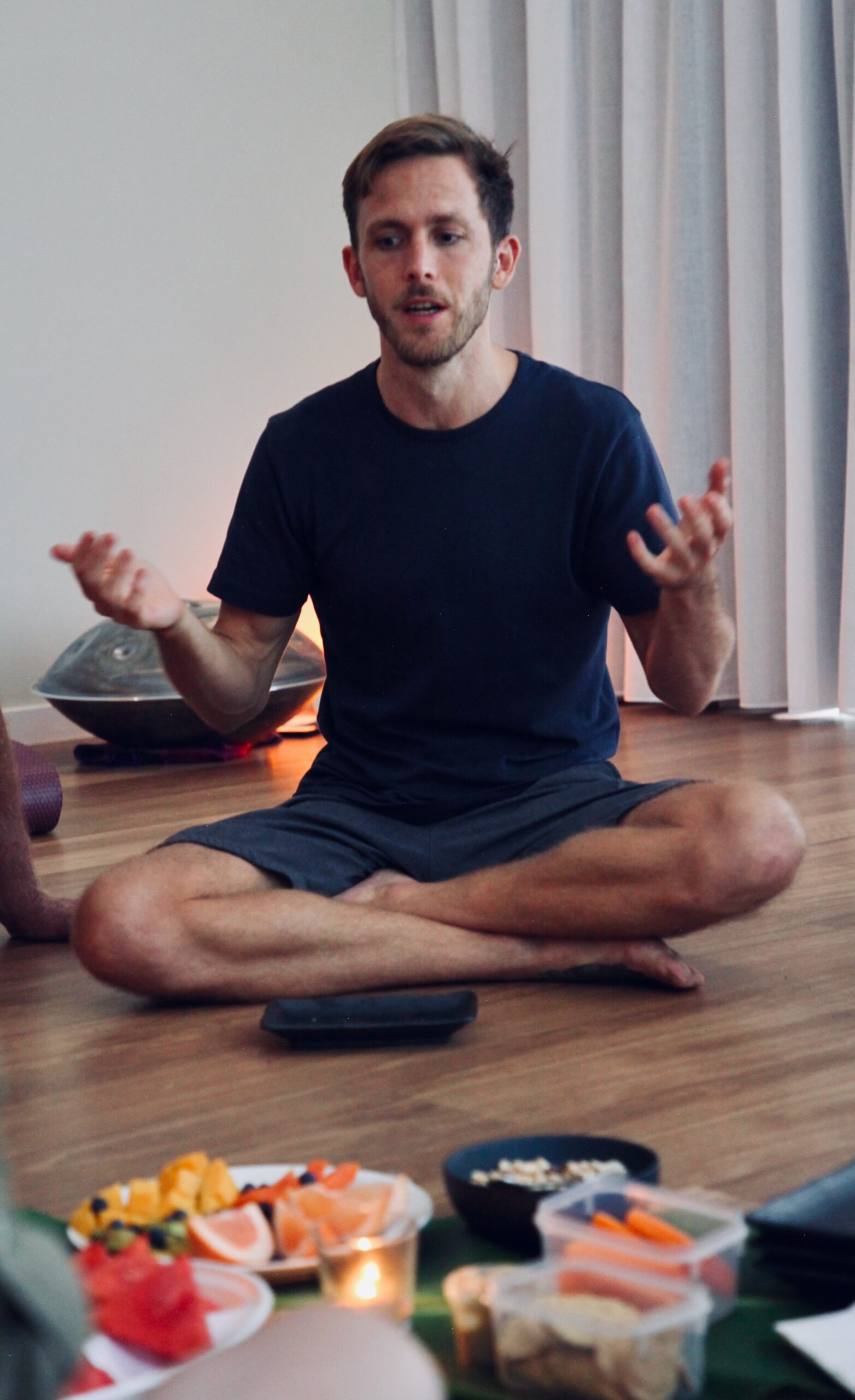 Campbell Will seated leading a breathwork circle