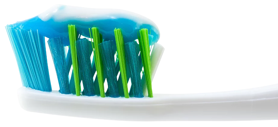 Close-up of a toothbrush with blue toothpaste