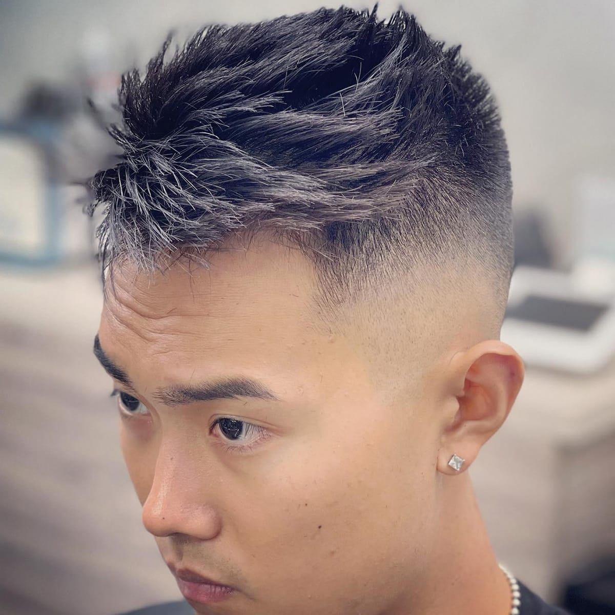 Close-up of a textured spiky crop with skin fade