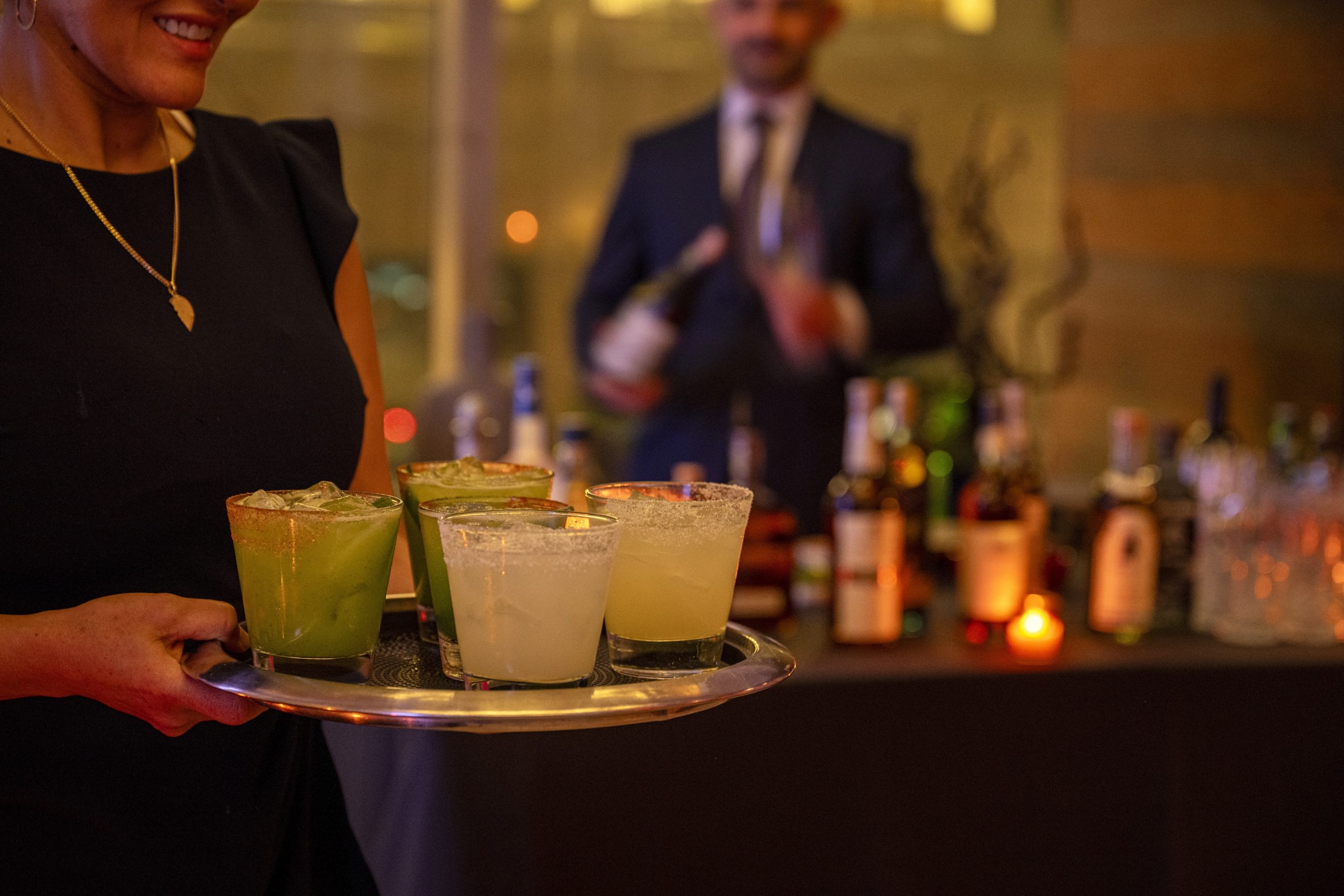 A server carries a tray of margaritas through a cocktail reception at Empellón, 510 Madison.
