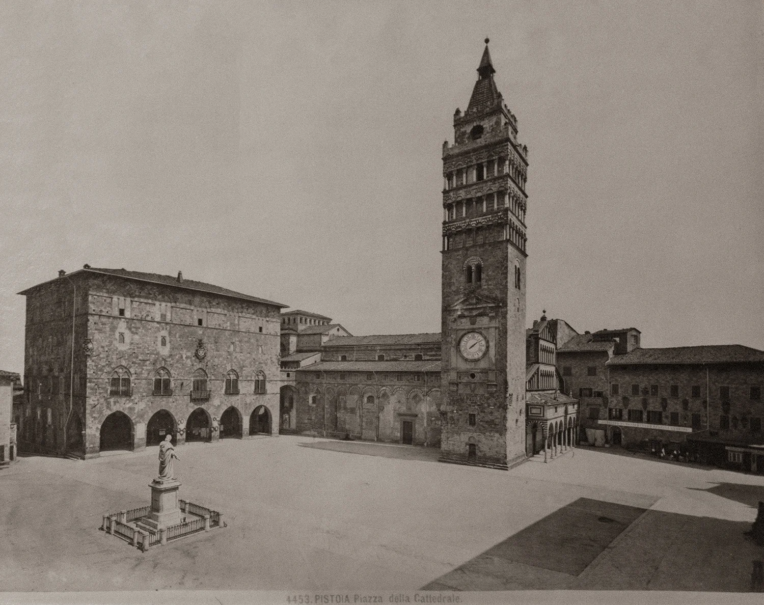 Vintage sepia photograph of Pistoia's Piazza della Cattedrale with its bell tower and medieval buildings