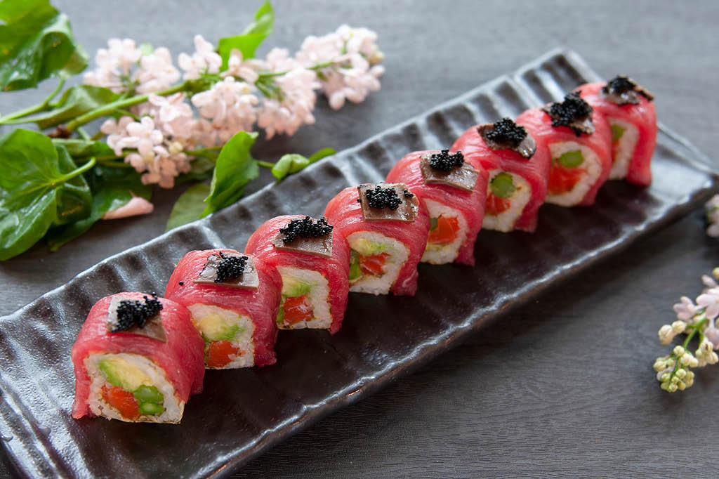 Tuna-wrapped sushi rolls with black caviar