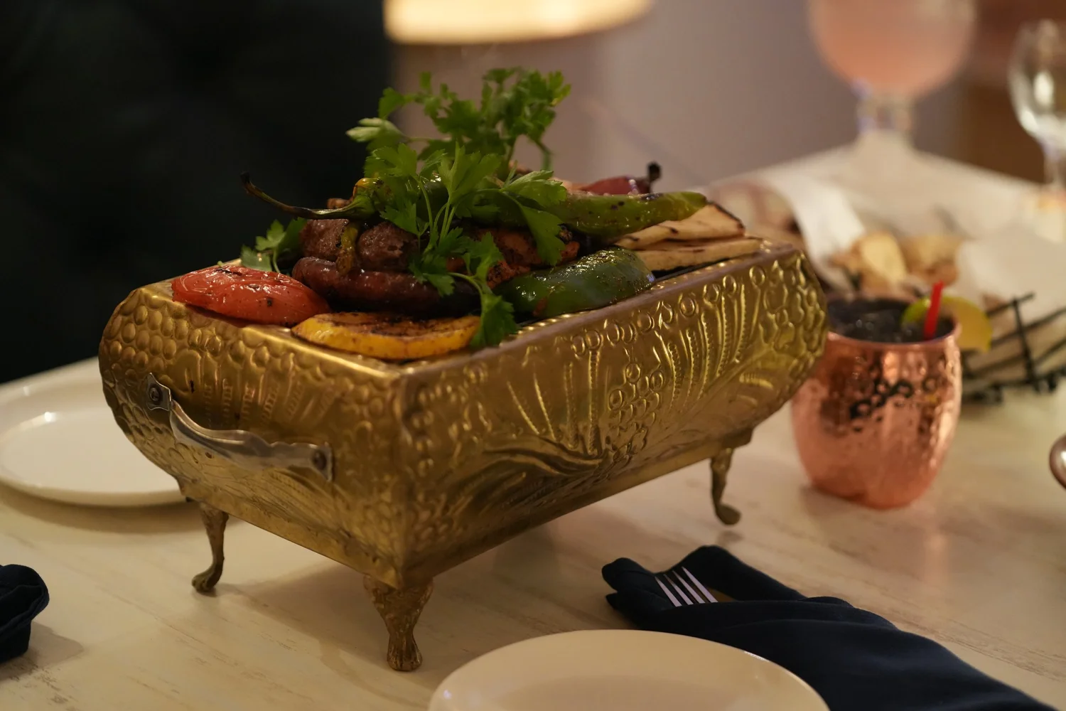 Mixed grill platter served in an ornate brass tray at Horus Café on A