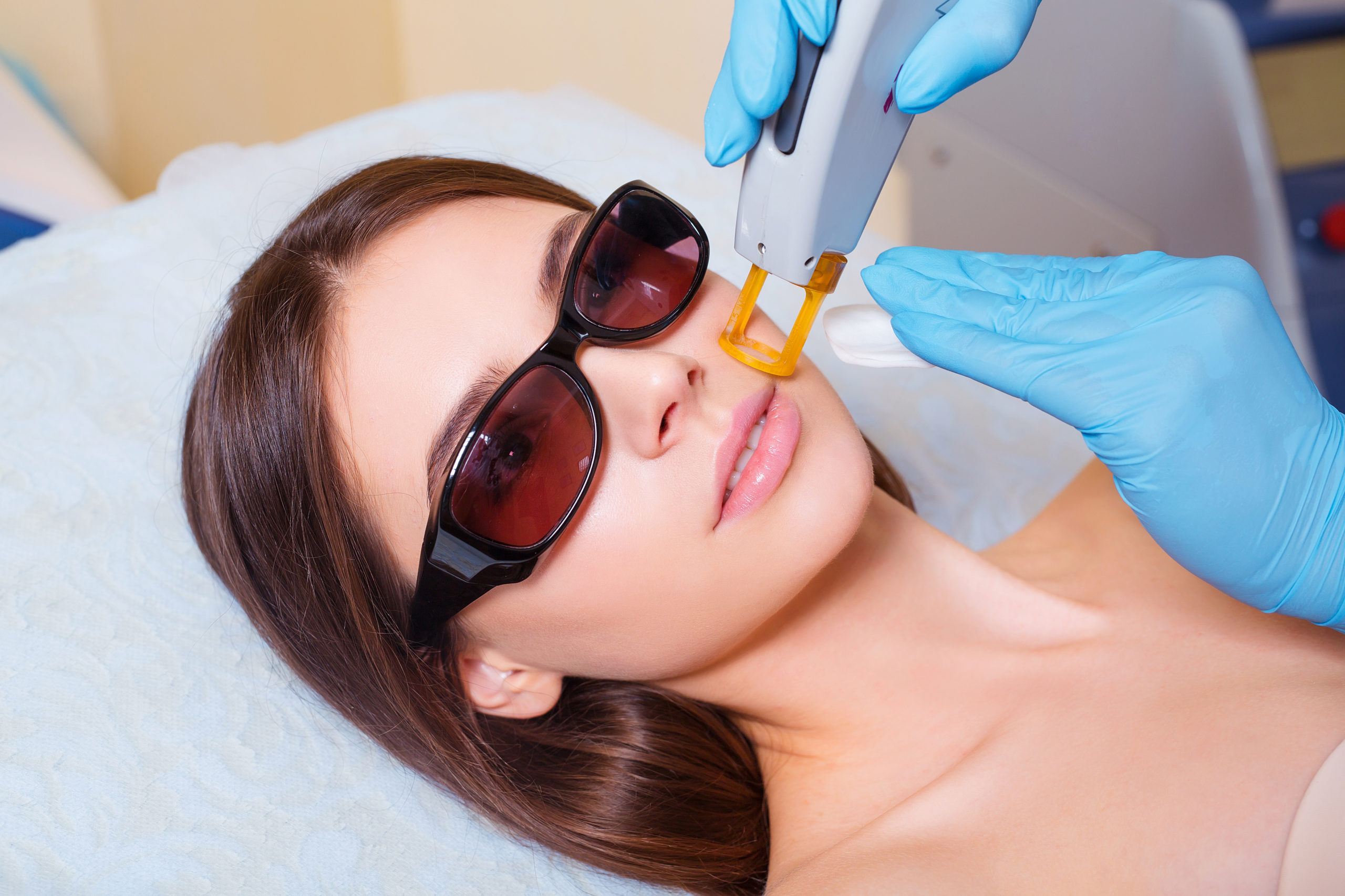 A woman receiving a laser skin treatment
