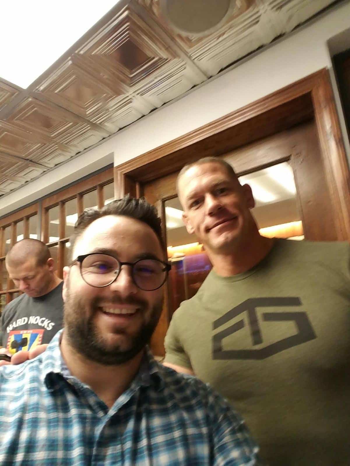 John Cena taking a selfie with the barber at Makas Barbershop