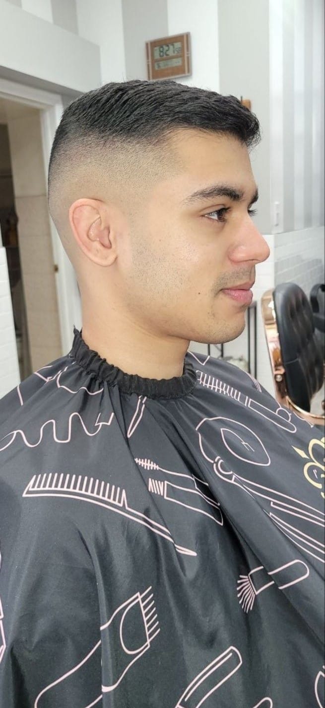 Client profile with a short fade and textured top