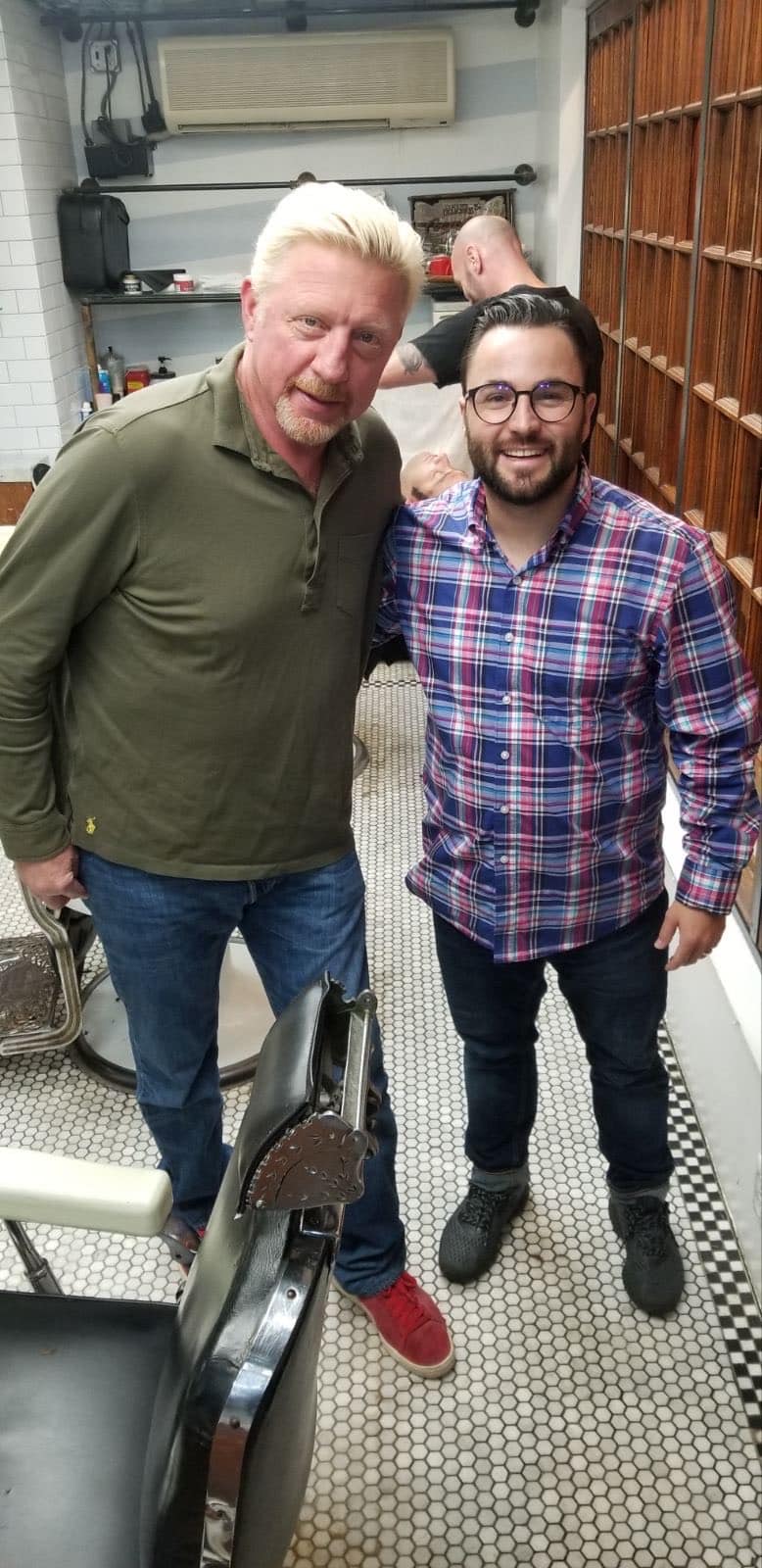 Boris Becker posing with the barber at Makas Barbershop
