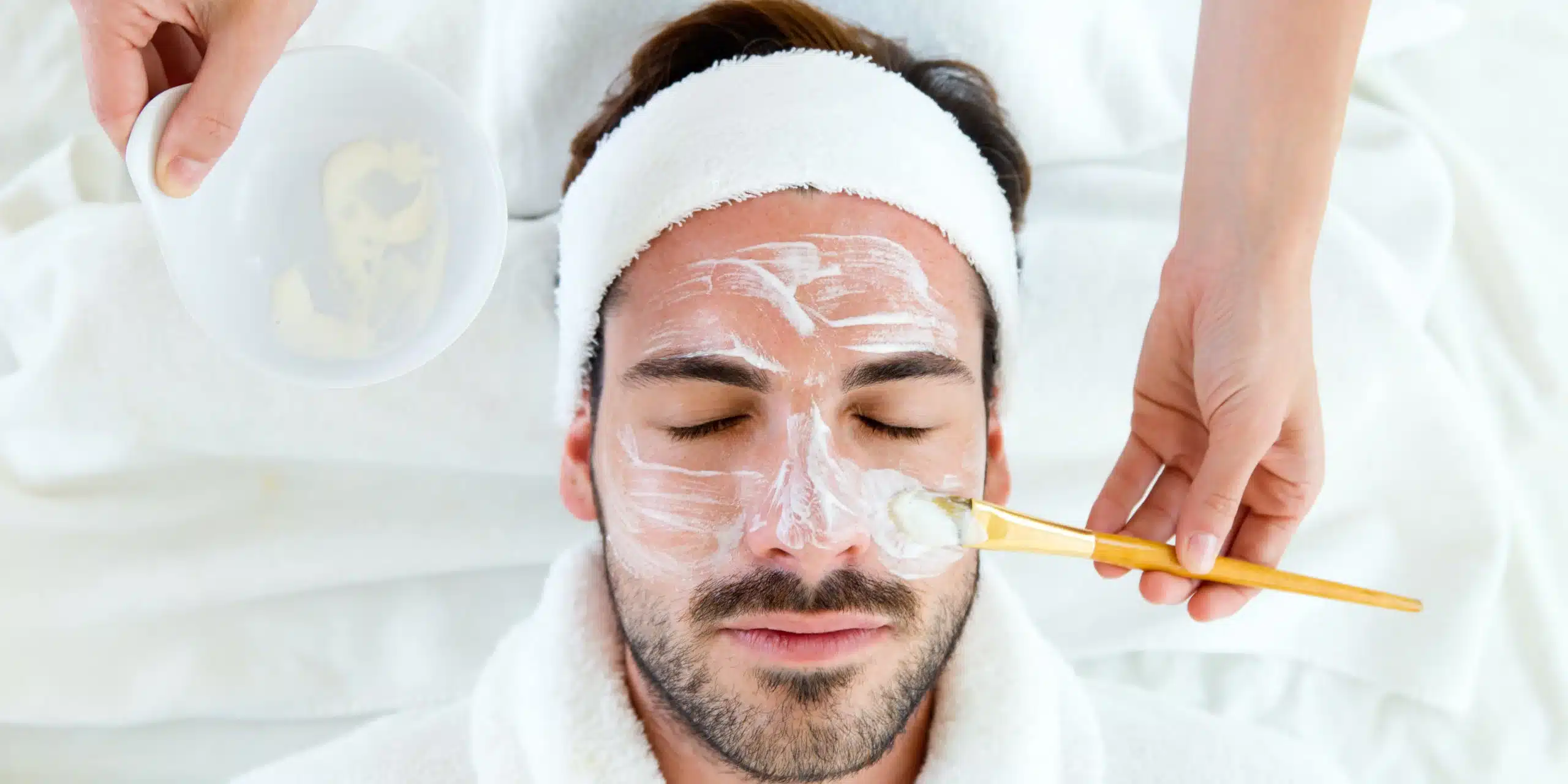 Man receiving a facial treatment