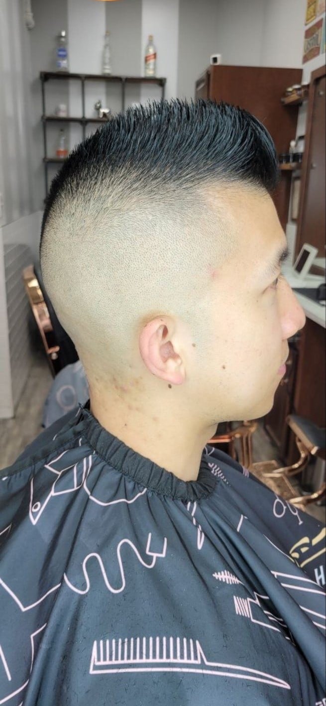 Client with a spiky top and skin fade
