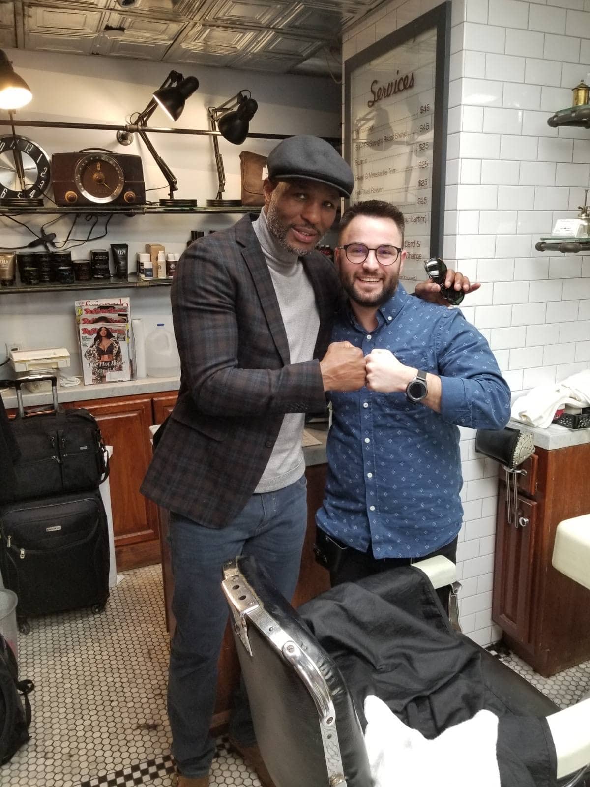 Bernard Hopkins fist-bumping the barber at Makas Barbershop