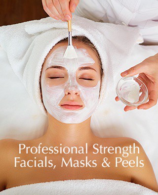 Woman receiving a professional facial mask treatment at Ohm Spa