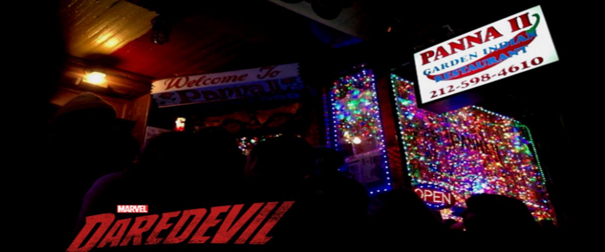 Panna II exterior entrance glowing with colored lights at night