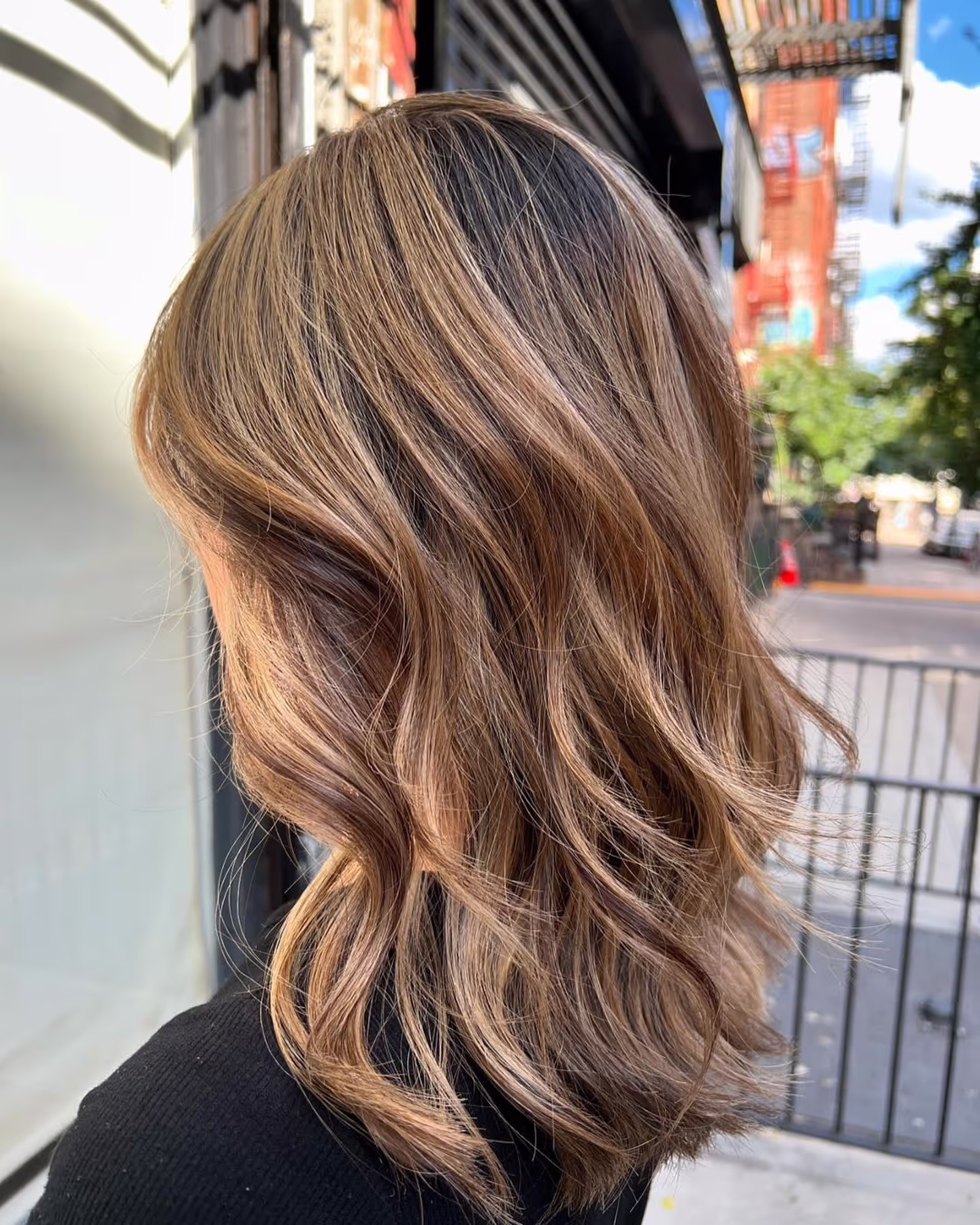 Client hair result by Redge Salons — sunlit balayage waves