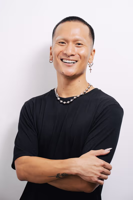 Aaron, Redge Salons stylist, studio portrait on a white background