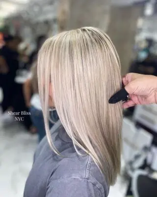 Bright blonde straight lob haircut