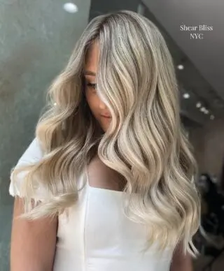 Client with long wavy blonde hair