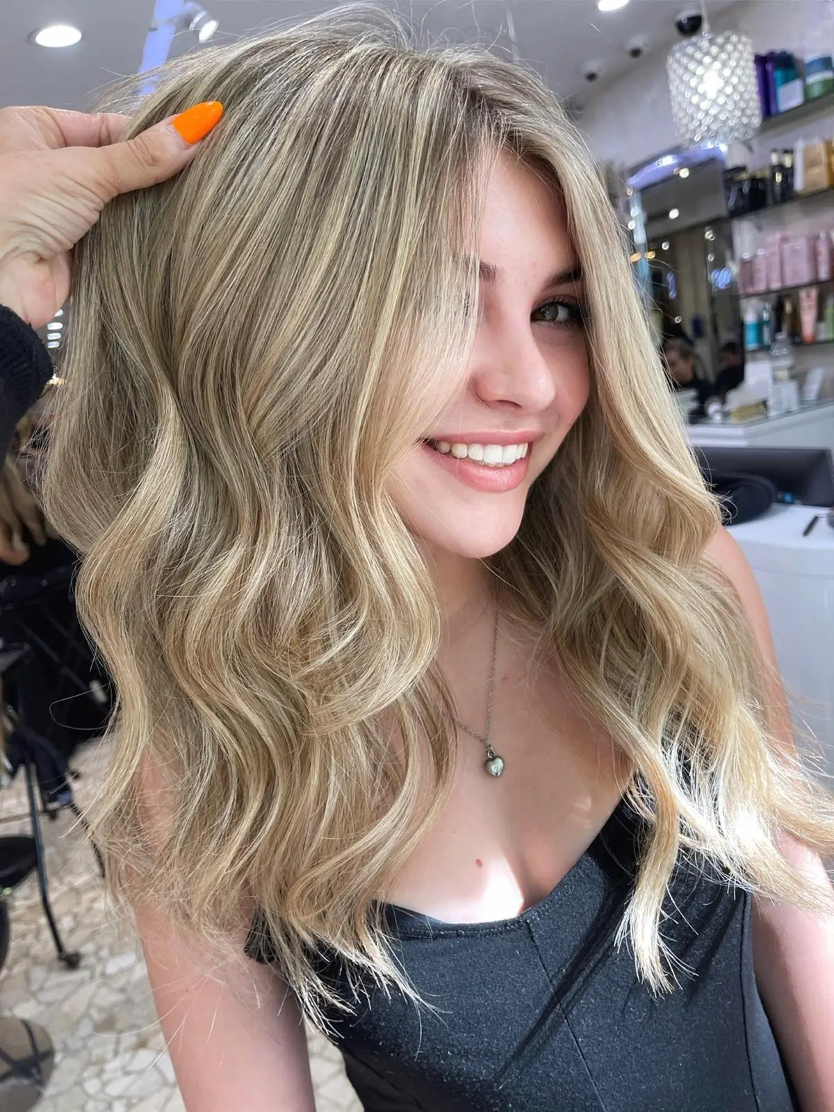 Smiling client with sandy blonde waves