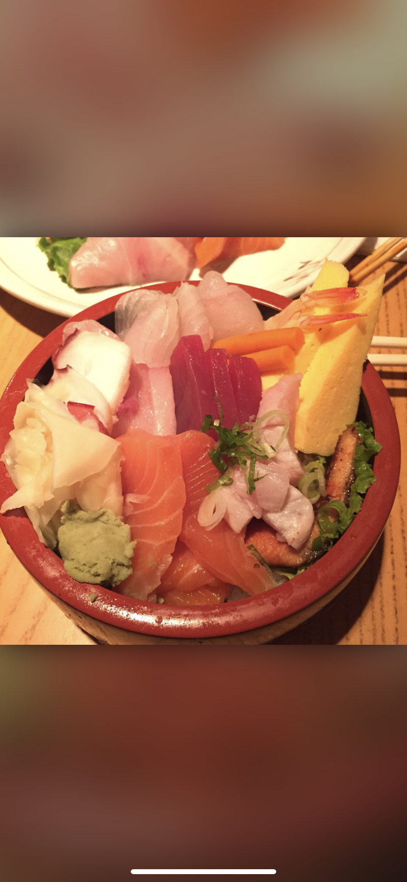 Chirashi don in a red lacquer bowl