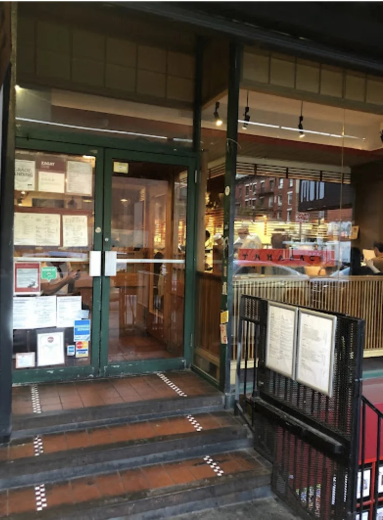 The Takahachi storefront on Avenue A, green-framed doors