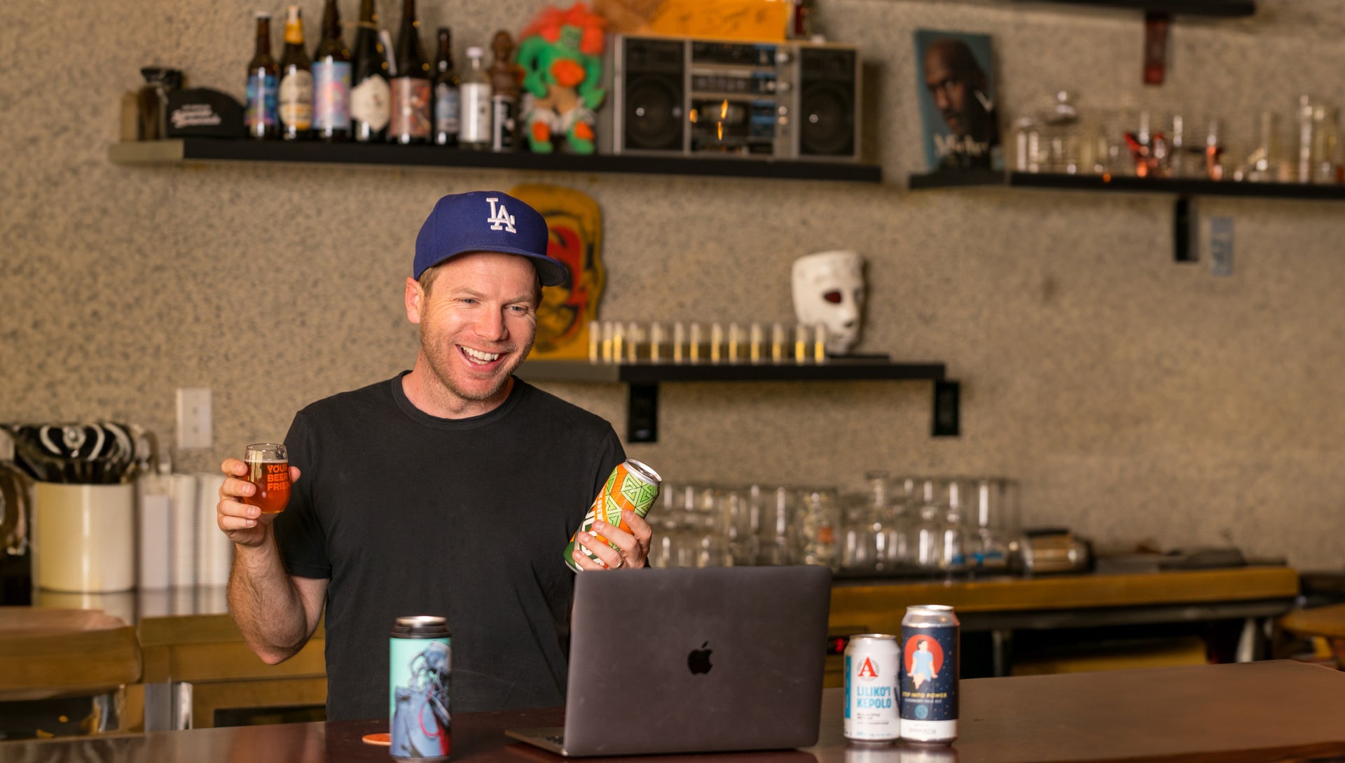 A Your Beer Friend host presenting craft beer during a private virtual tasting