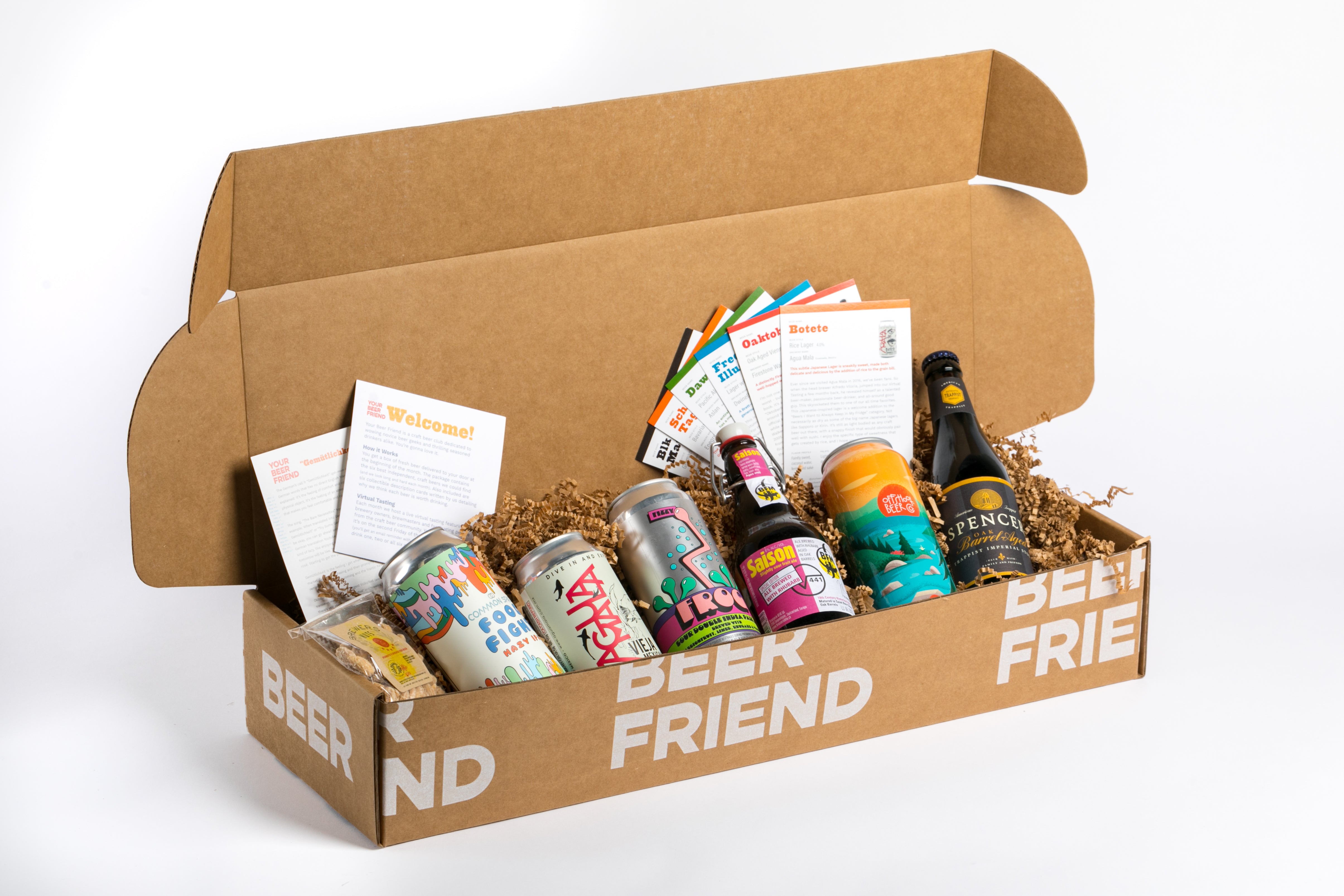 A Your Beer Friend tasting box packed with craft beer cans and tasting notes