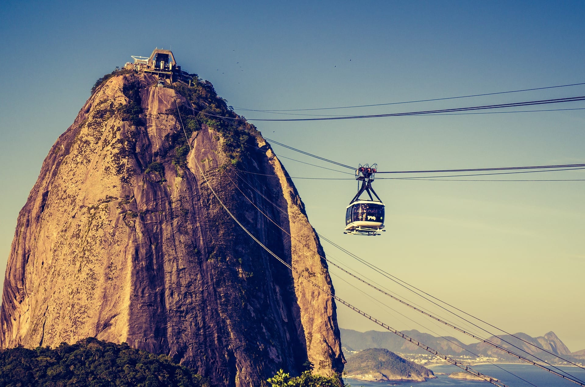 Sugarloaf Mountain in Rio de Janeiro with a cable car gondola in the foreground