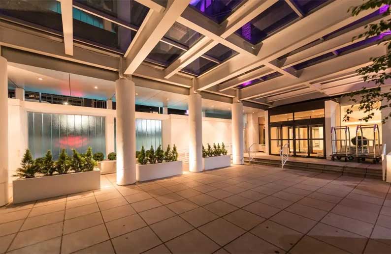 New Rochelle building entrance at night
