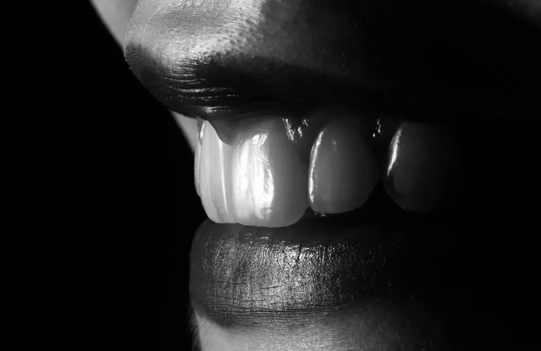 Black-and-white close-up of a smile