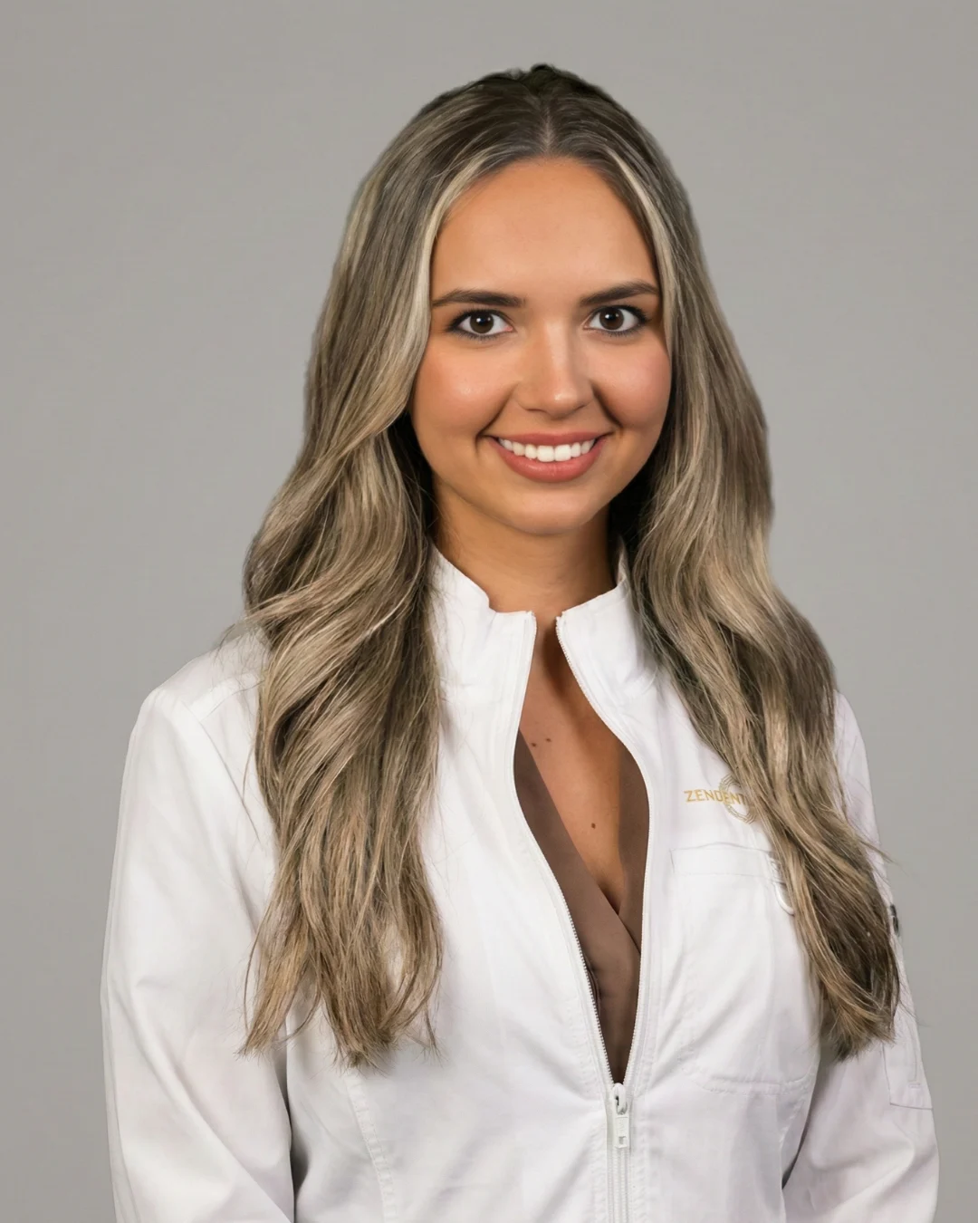 Zen Dentistry provider in branded white lab coat