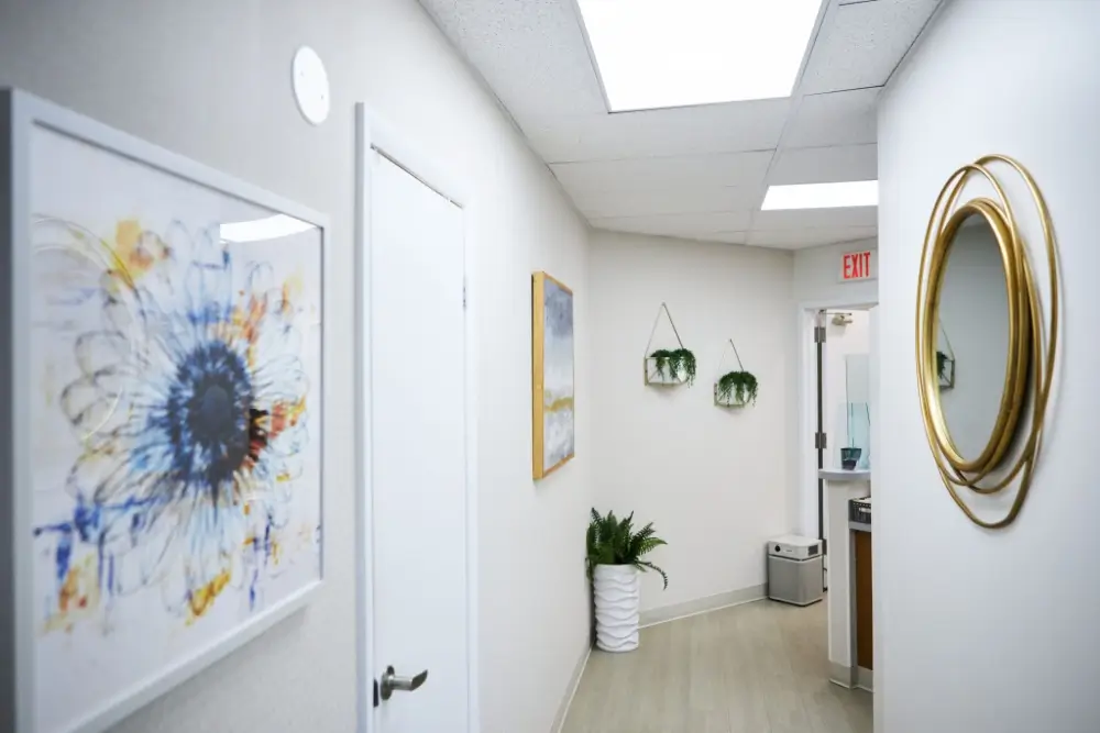 Forest Hills clinic hallway with art and plants