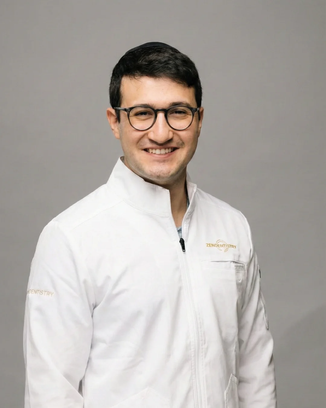 Zen Dentistry dentist in branded white lab coat