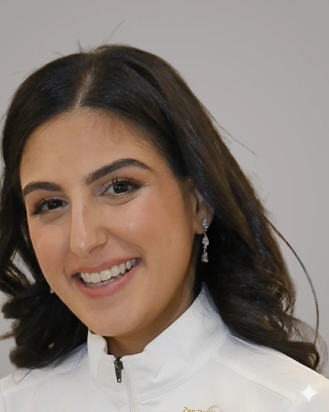 Zen Dentistry team member in branded white jacket
