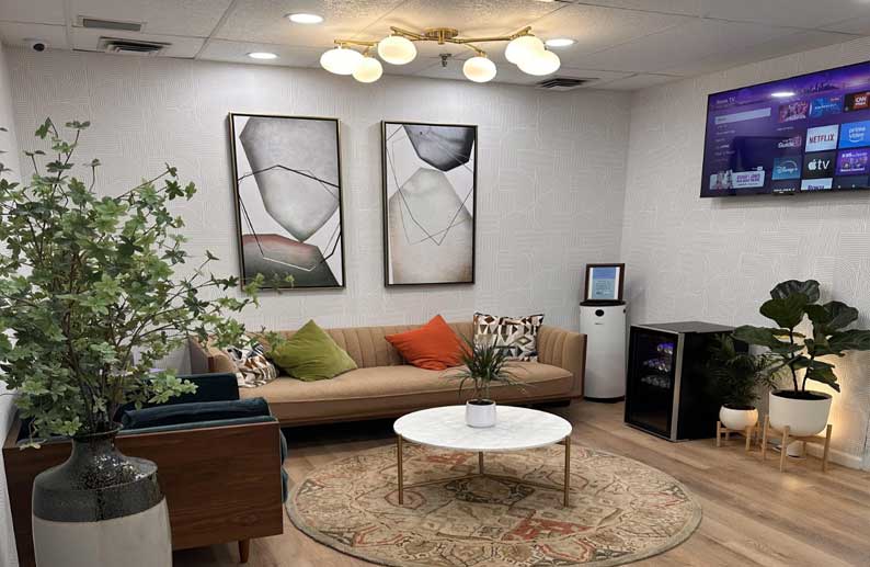 Union Square waiting room with sofa and plants